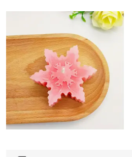 Weihnachtssternförmige Schneeflocken-Aromakerze.