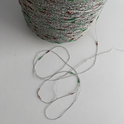 Konenwolle Merinowolle mit  Lurex.