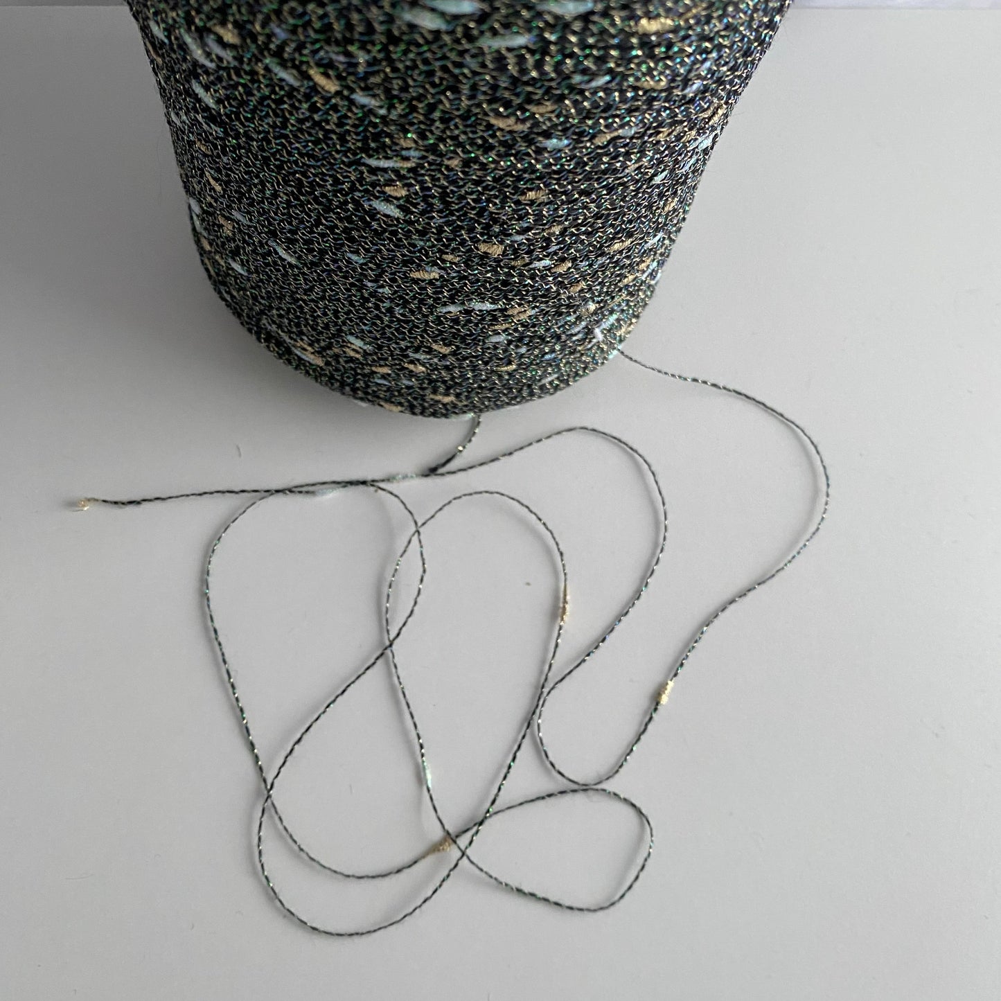 Konenwolle Merinowolle mit  Lurex.