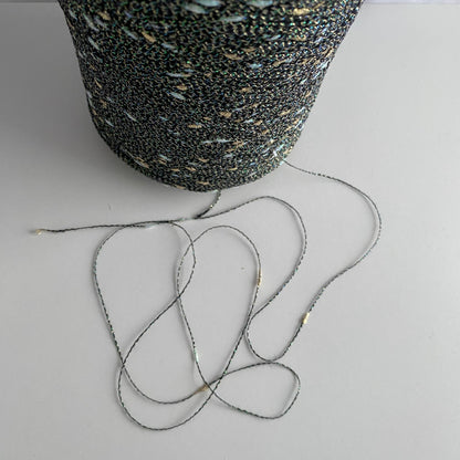 Konenwolle Merinowolle mit  Lurex.