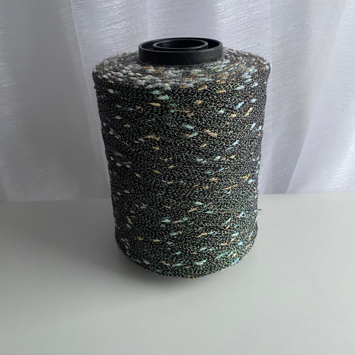Konenwolle Merinowolle mit  Lurex.